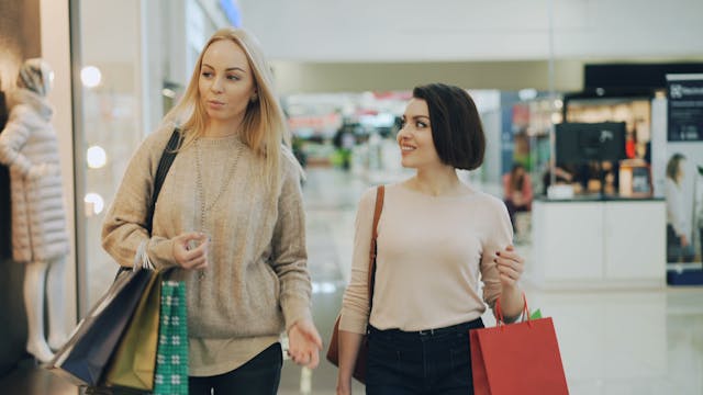 shopping in a mall, carrying bags