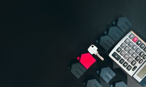 calculator, houses, and a key
