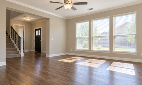 Empty rental home with clean hardwood floors and natural lighting, illustrating the rent-ready turnover process for Katy, Texas landlords.